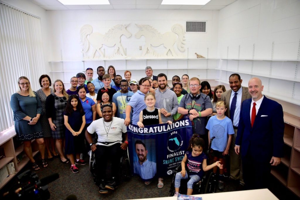 Photo of finalist and his students.