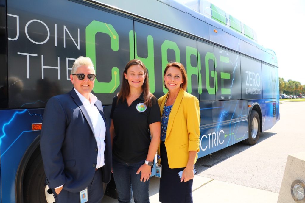 Commissioner Nikki Fried poses in front of one of PSTA’s newest all-electric buses.