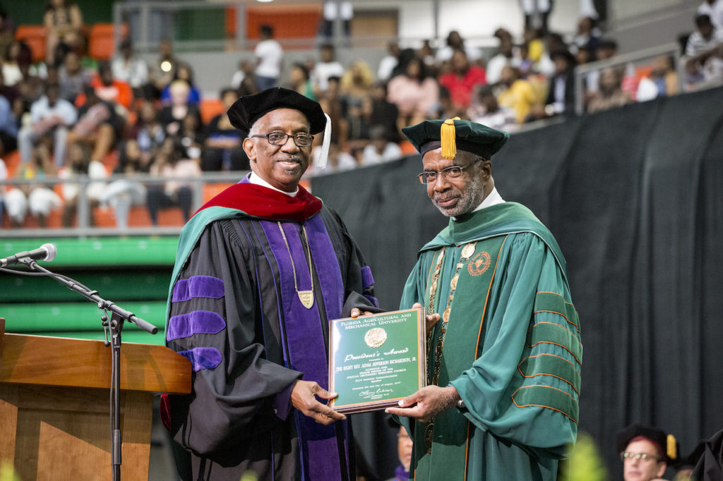 Senior AME Bishop Adam J. Richardson Jr. (left) accepts award from FAMU President Larry Robinson, Ph.D.
