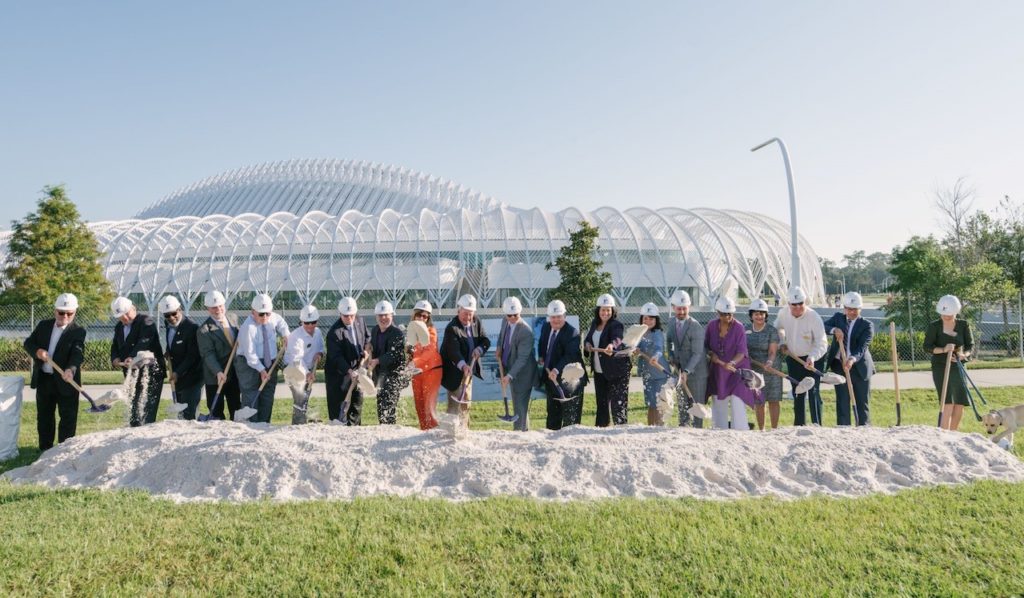 Photograph of Florida Polytechnic University leaders and community and state officials holding shovels and breaking the ground on state-of-the-art research building.