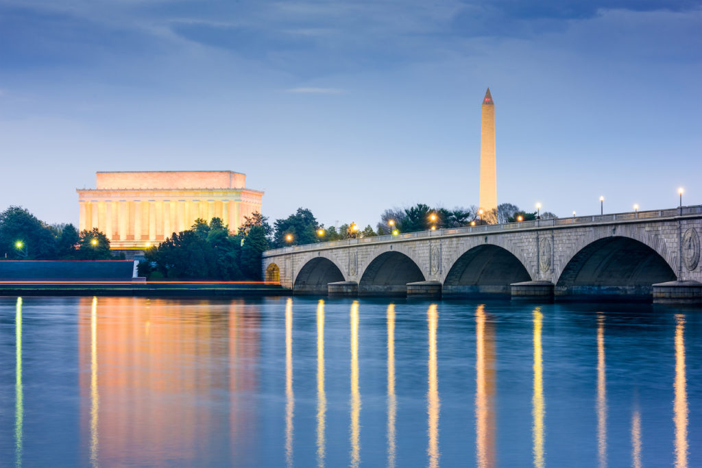 Washington DC, USA skyline on the Potomac River with Lincoln Memorial, Washington Monument, and Arlington Memorial Bridge.