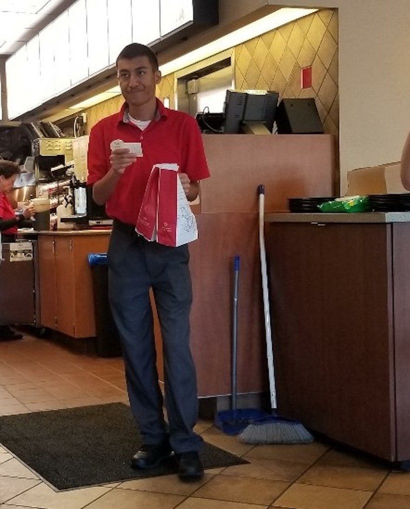 Andrew Wong delivers an order at Chick-fil-A in Pace.