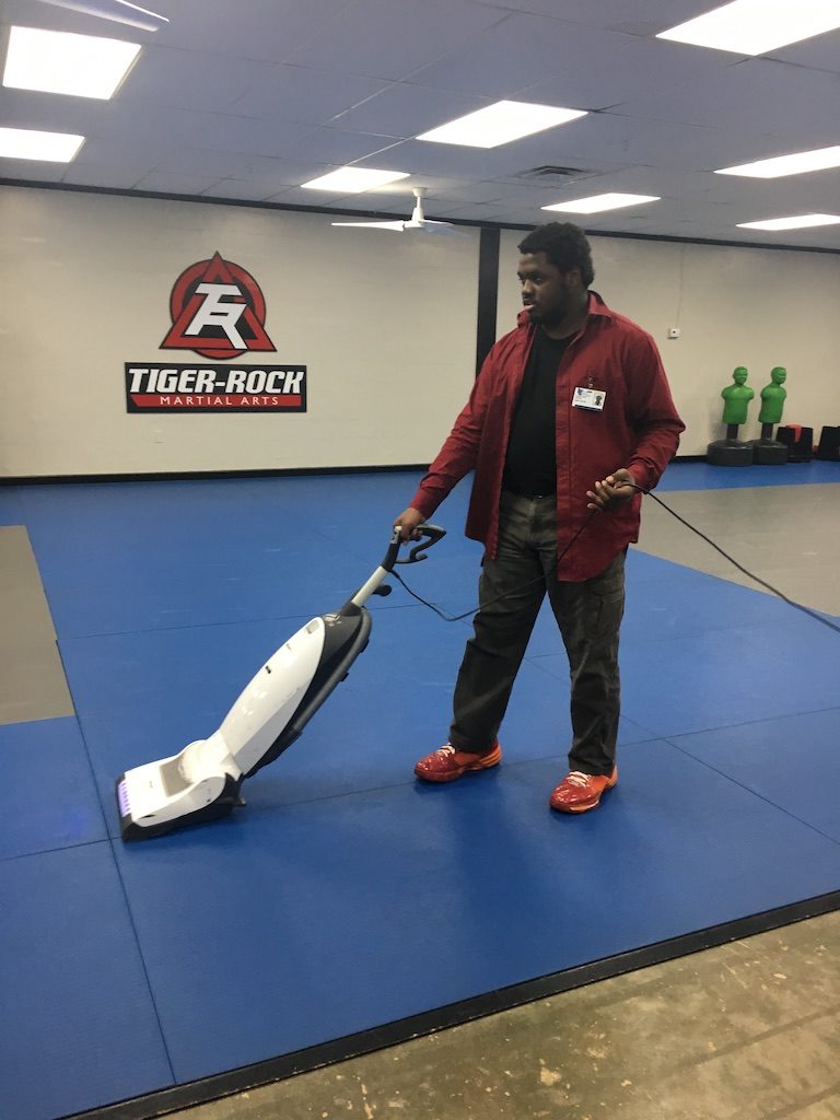 Jason Hunter enjoys being a custodian at Tiger Rock Martial Arts in Tallahassee.