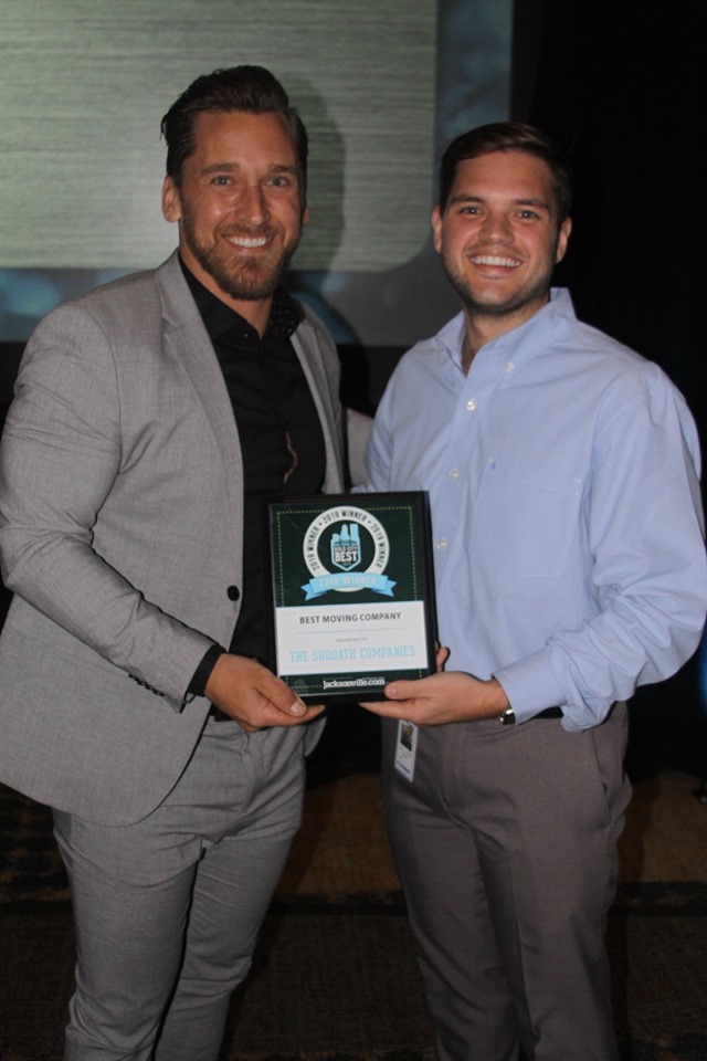 Scott Sheplak II (Left), local sales, and Mitchell Zvaigzne (Right), dispatch manager accepting the Best Moving Company award.