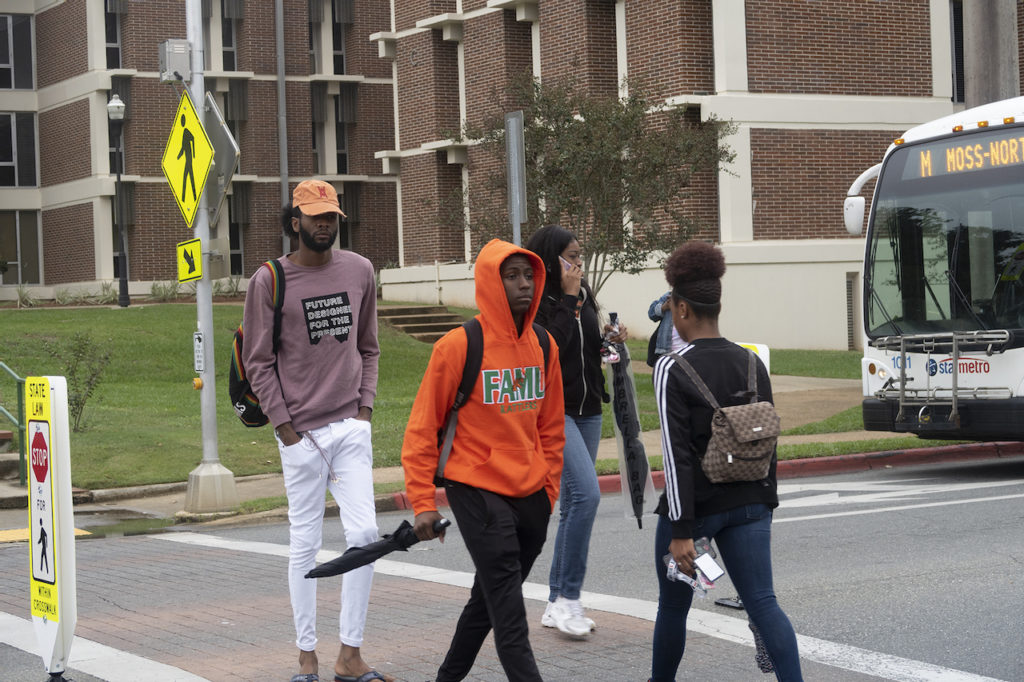 FAMU students walking through crosswalk.