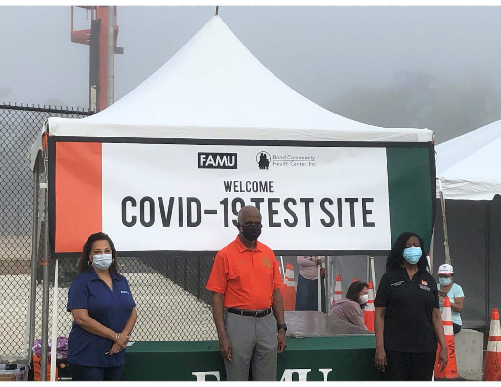 (From left) Bond CEO Dr. Temple Robinson, FAMU President Larry Robinson, Ph.D., and Cynthia Harris, Ph.D., director of the FAMU Institute of Public Health, at the opening of the COVID-19 testing site.
