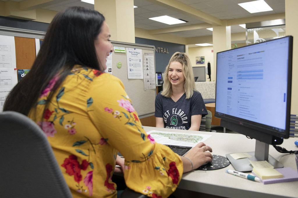 UWF student with admissions representative 