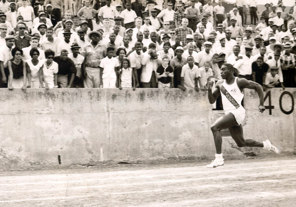 Bob Hayes running with both feet off the ground