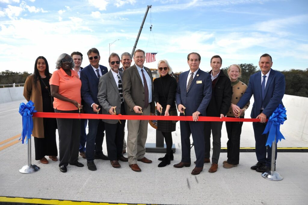 FDOT District Five Secretary John Tyler, Volusia County Chair Jeff Brower, Lake County Chairman Kirby Smith, Sen. Tom Wright and other local elected officials, legislative aides, and representatives from FDOT and the bridge contractor cut the ribbon on the new State Road 44 Bridge over the St. Johns River between Volusia and Lake counties on November 30, 2023.